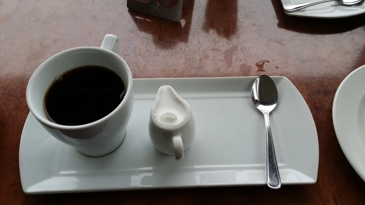 A cup of filter coffee on the breakfast tray
