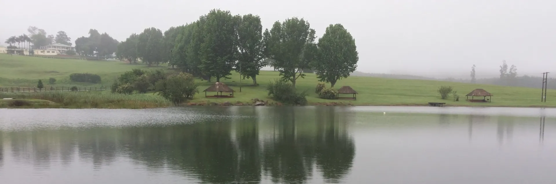 Drizzle drifting across the lake in the morning
