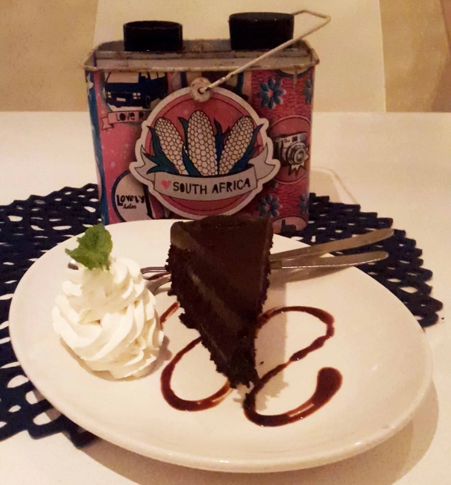 A chocolate dessert with cream