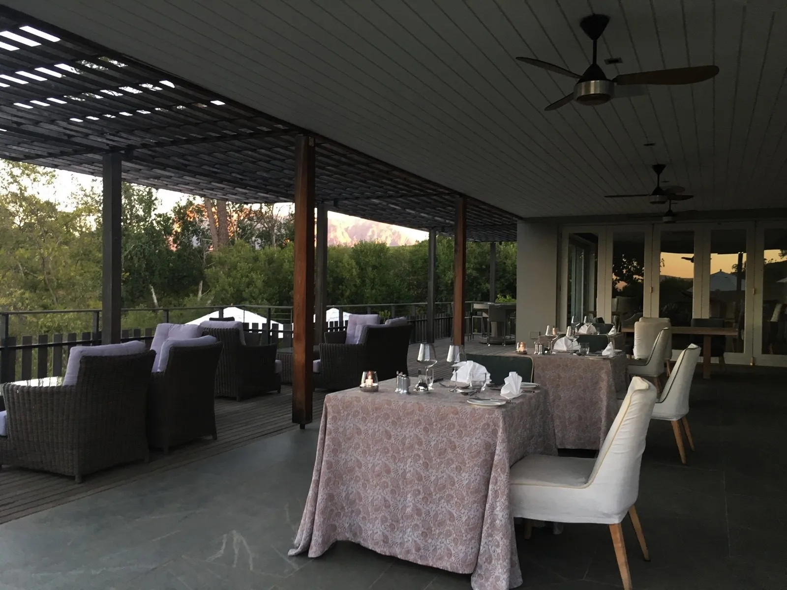 The open-sided lounge under ceiling fans
