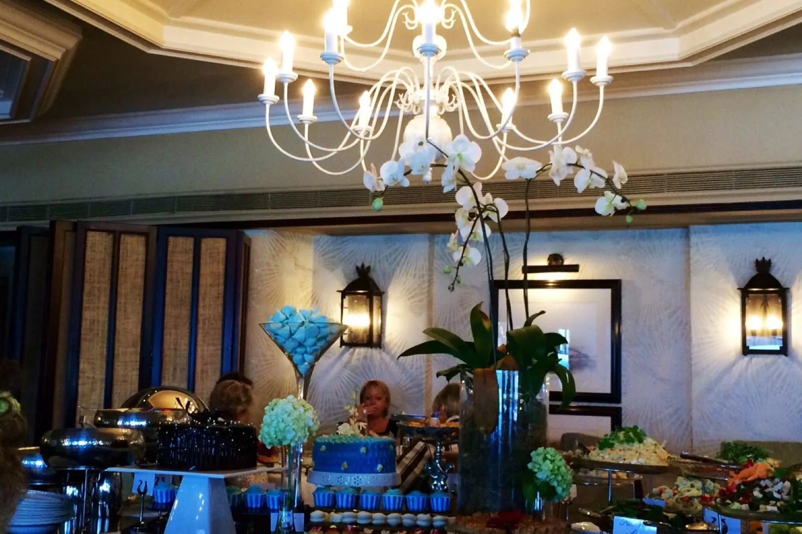 The dining room under chandeliers