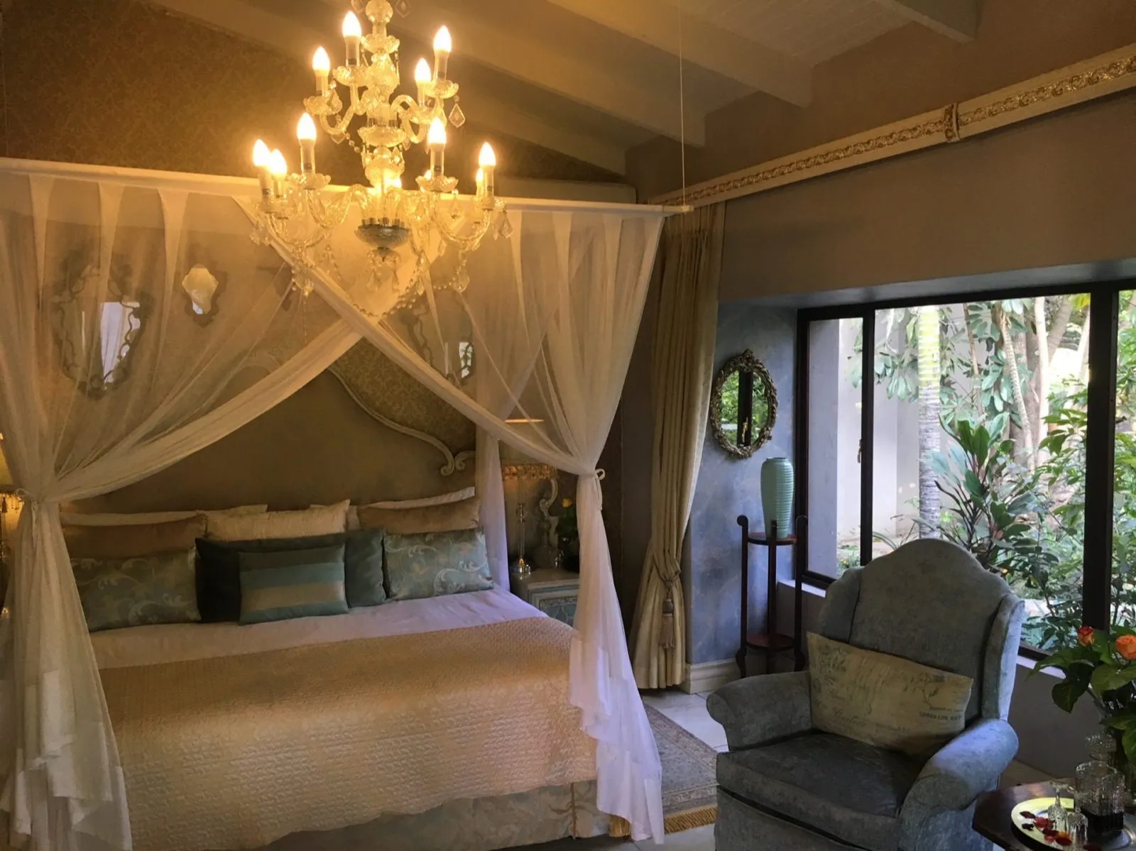 A four-poster bed under a mosquito net