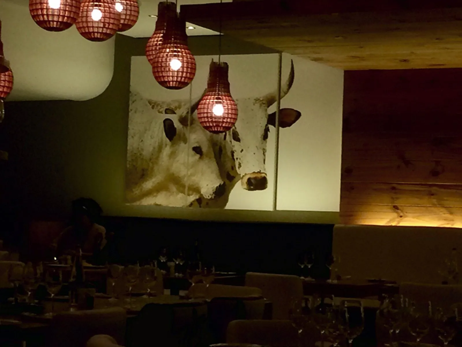 A cow portrait hung above the tables