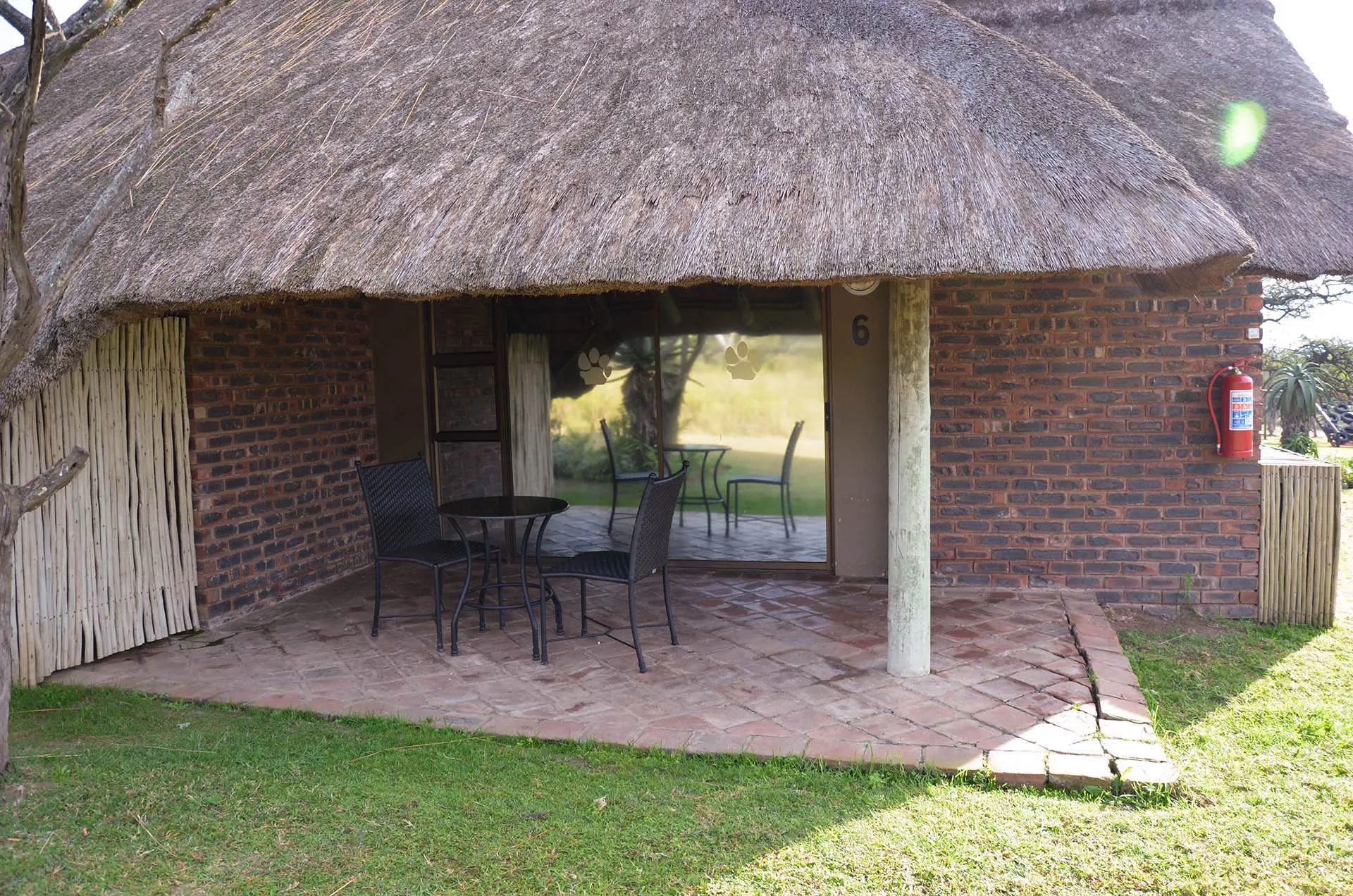 A thatched suite at Aloe Lodge among the trees