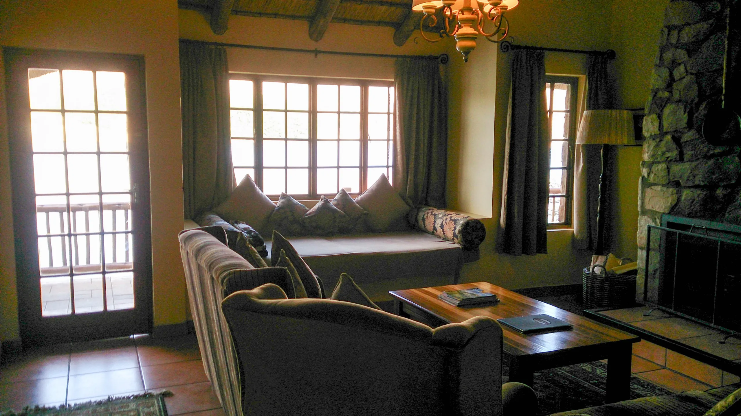The lounge inside the chalet, with its stone fireplace