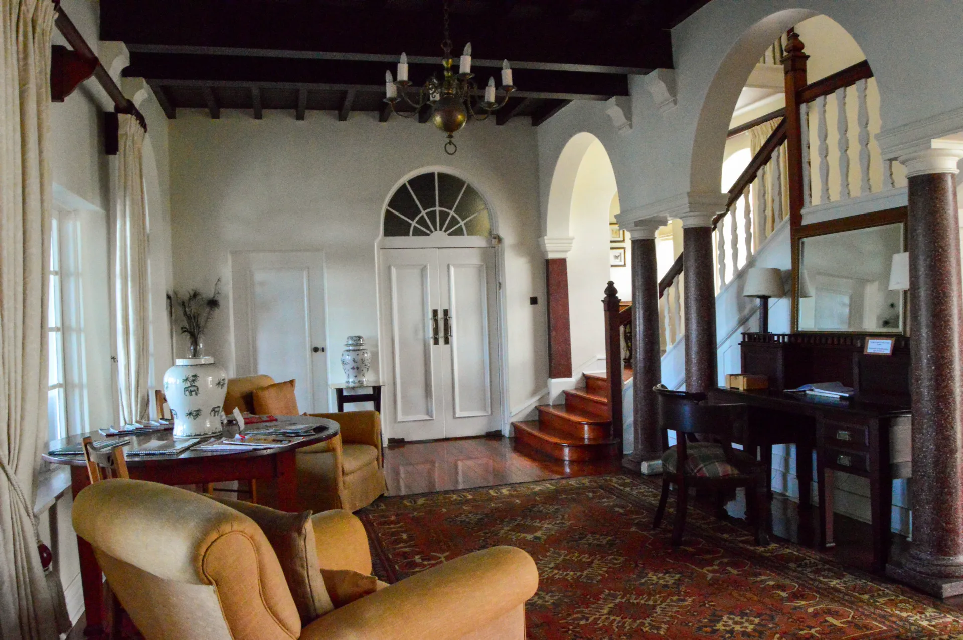 The entrance hall, arched and furnished with old world pieces