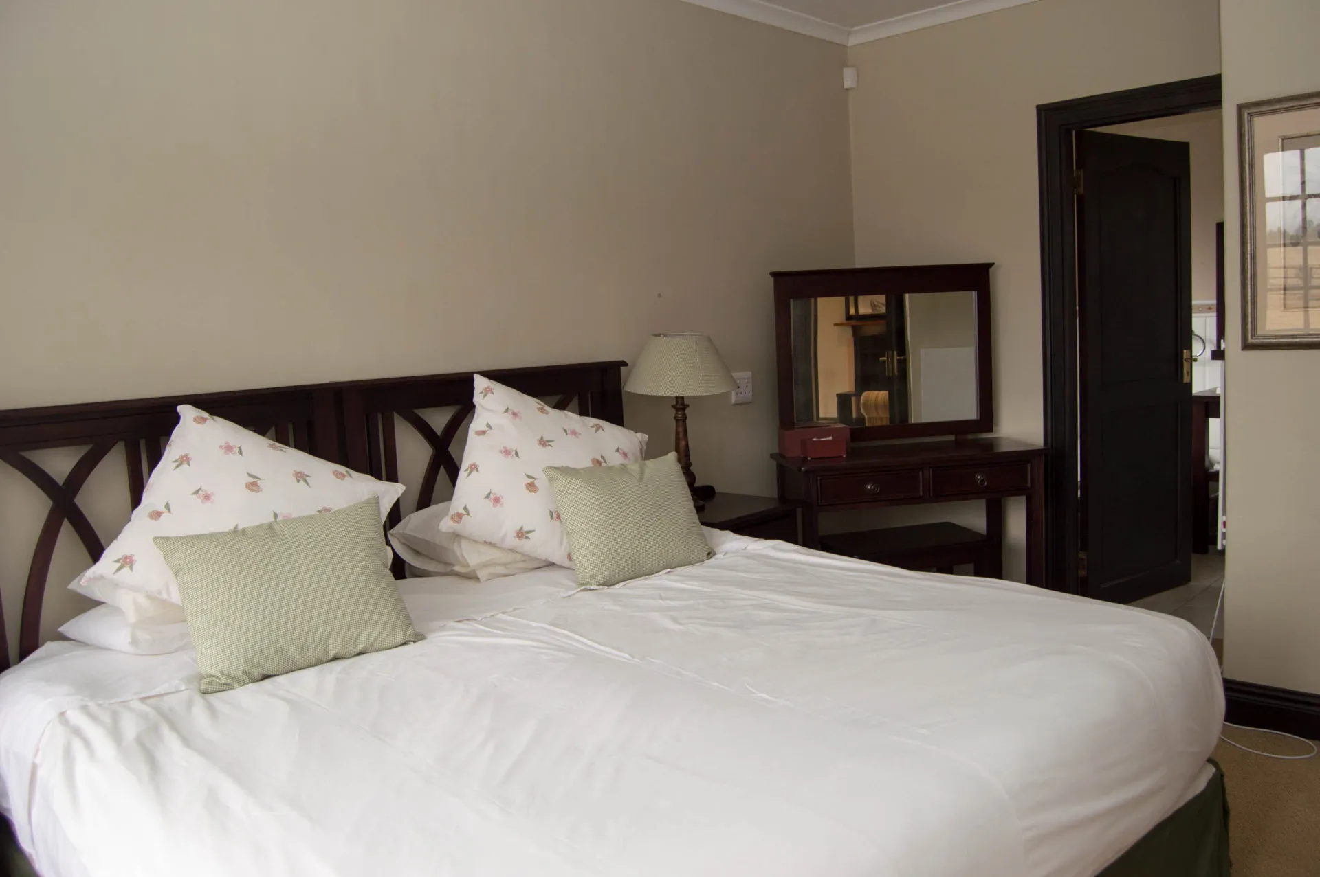 The second bedroom, made up with crisp white linen