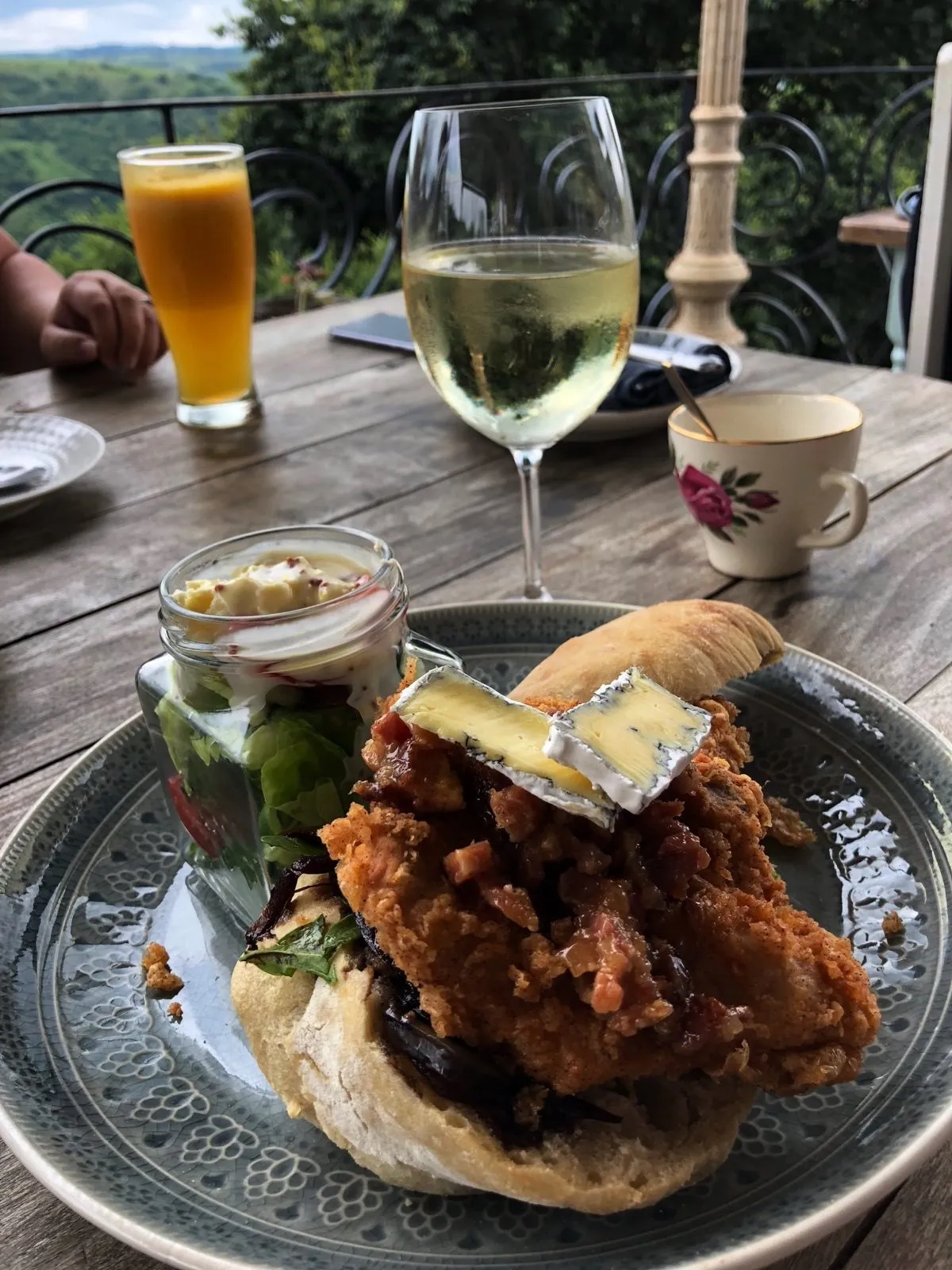 A burger and a cold beer on the balcony