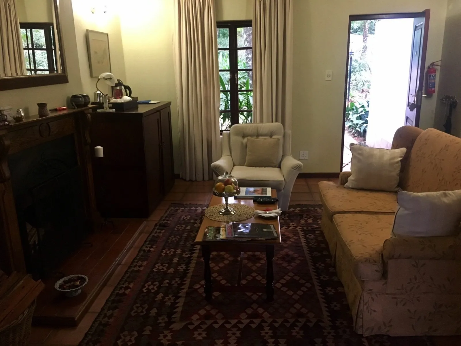 The lounge with rugs and a sideboard