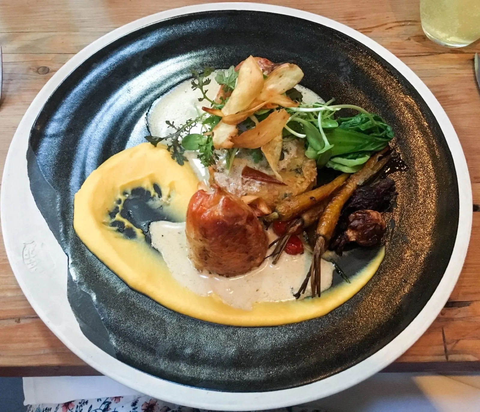 A plated main under sauce