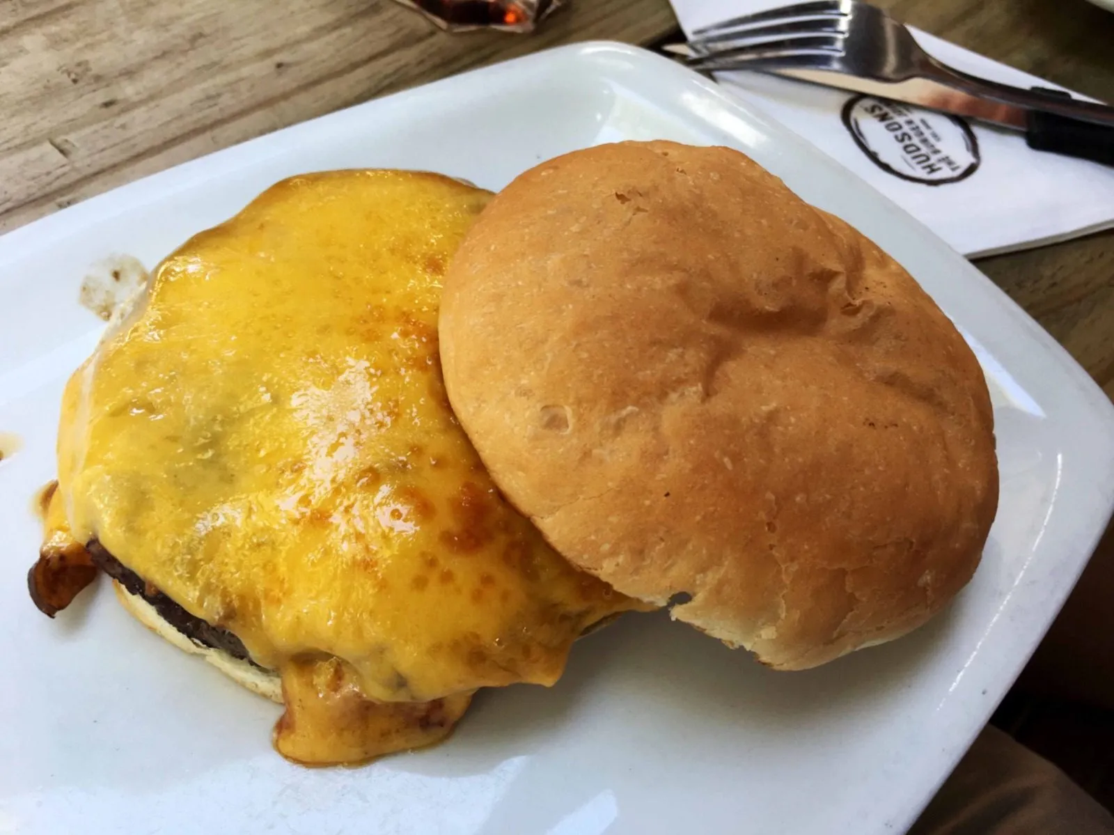 Two burger buns waiting on the plate