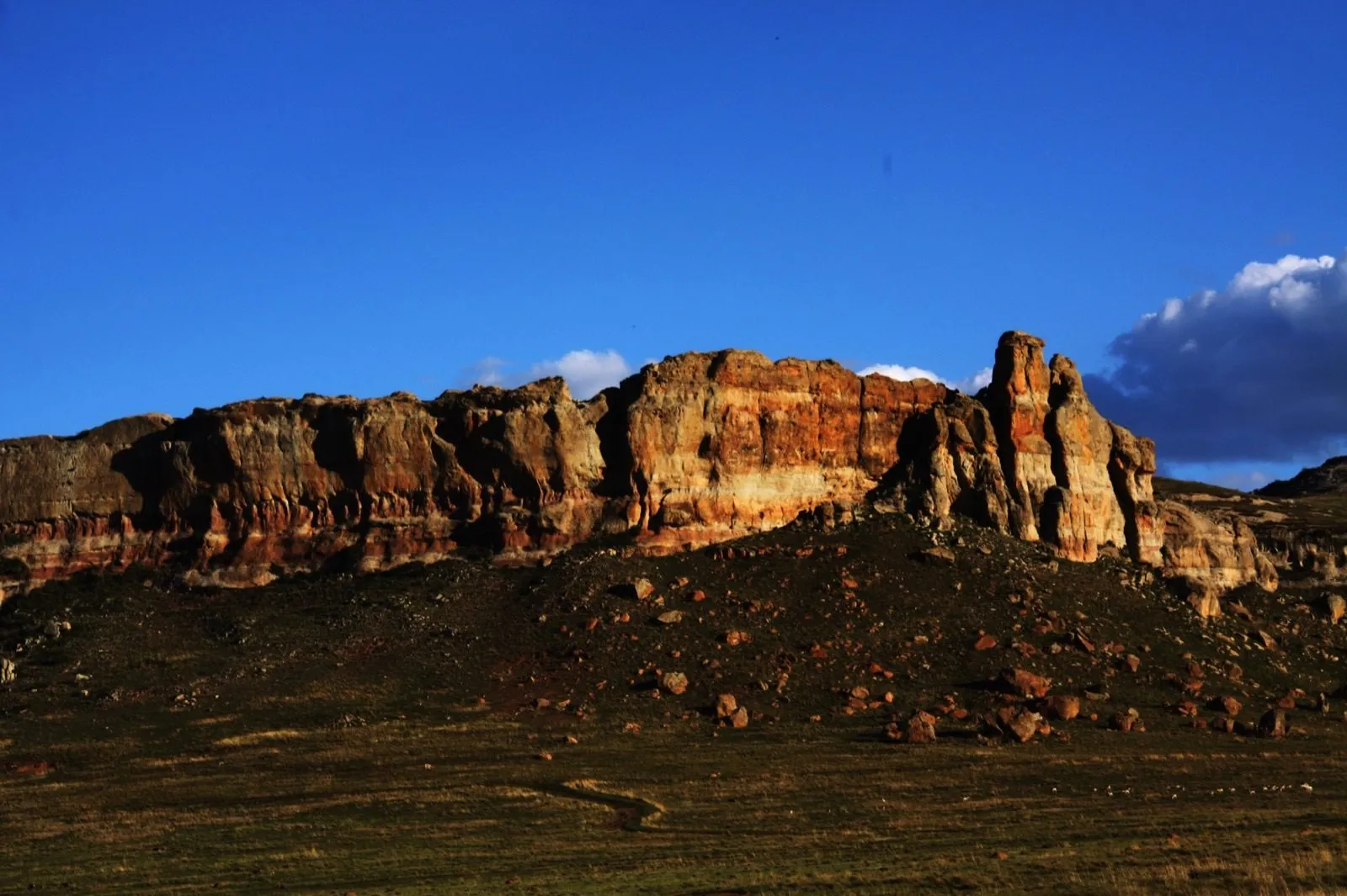 Sandstone cliffs above the town
