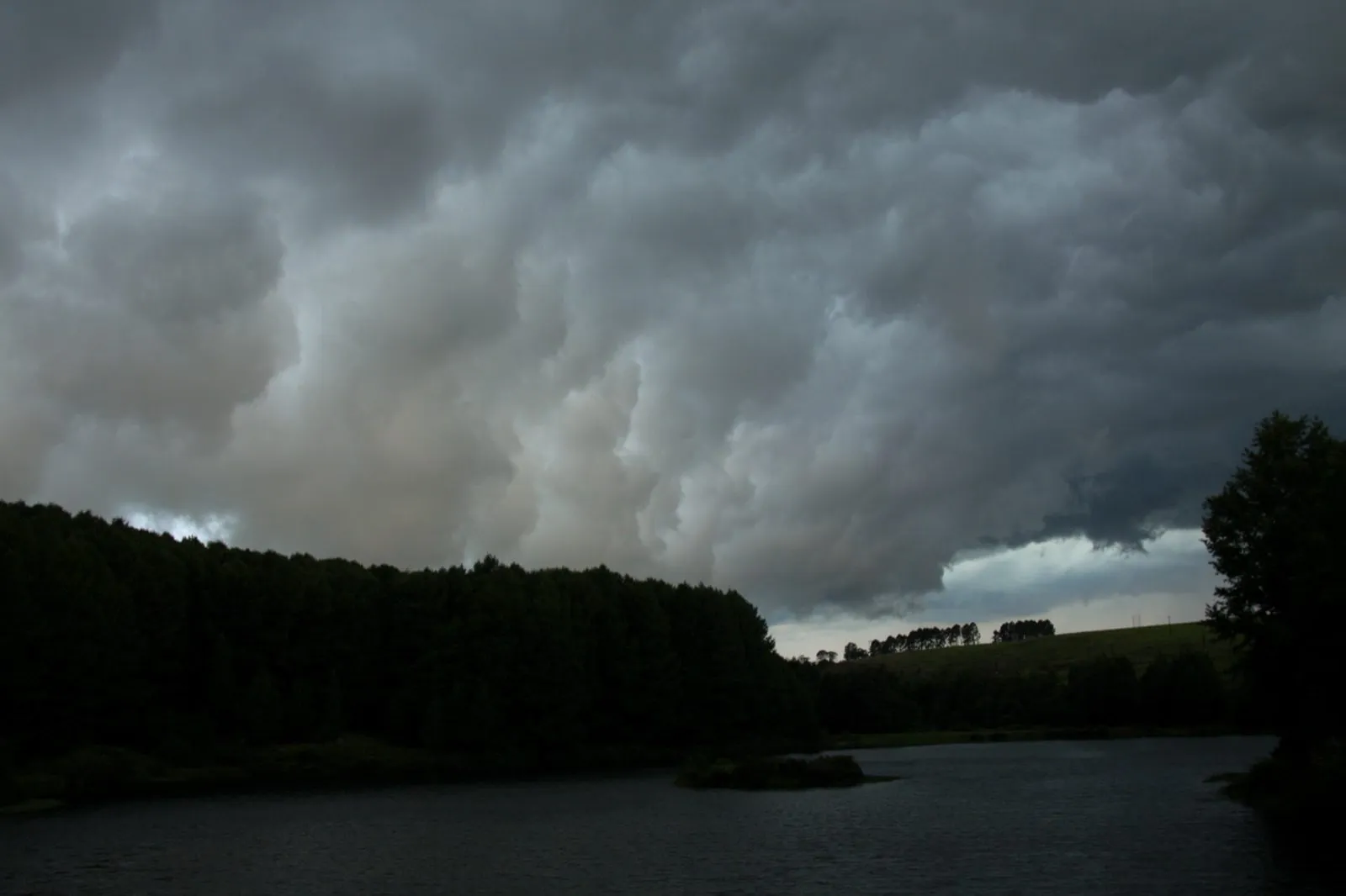 Dark water below a heavy sky