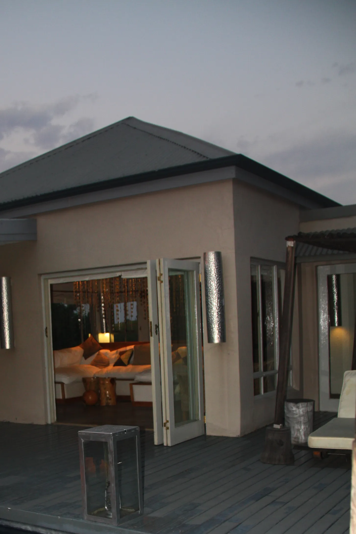 The lodge at dusk with its windows lit