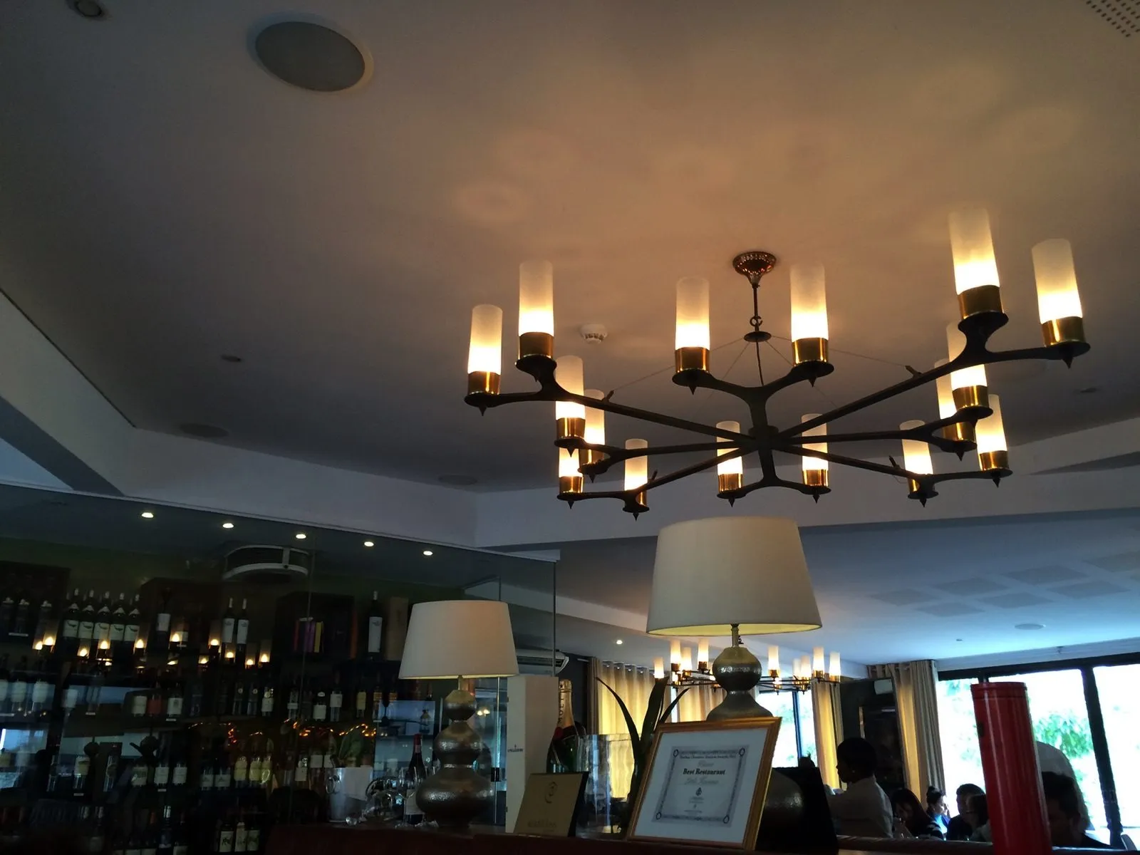 The dining room under its chandeliers