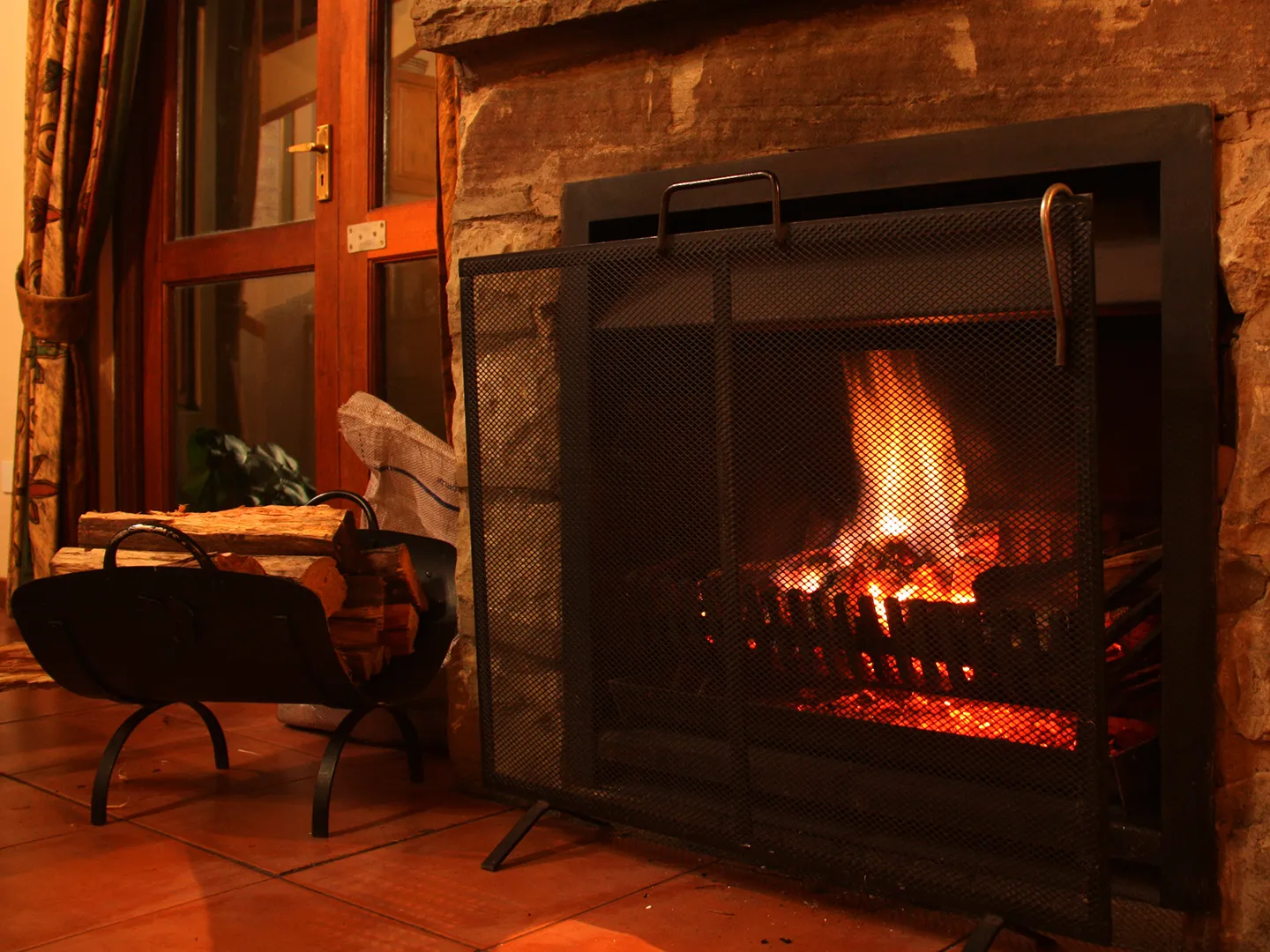 A fire burning in the suite's stone fireplace