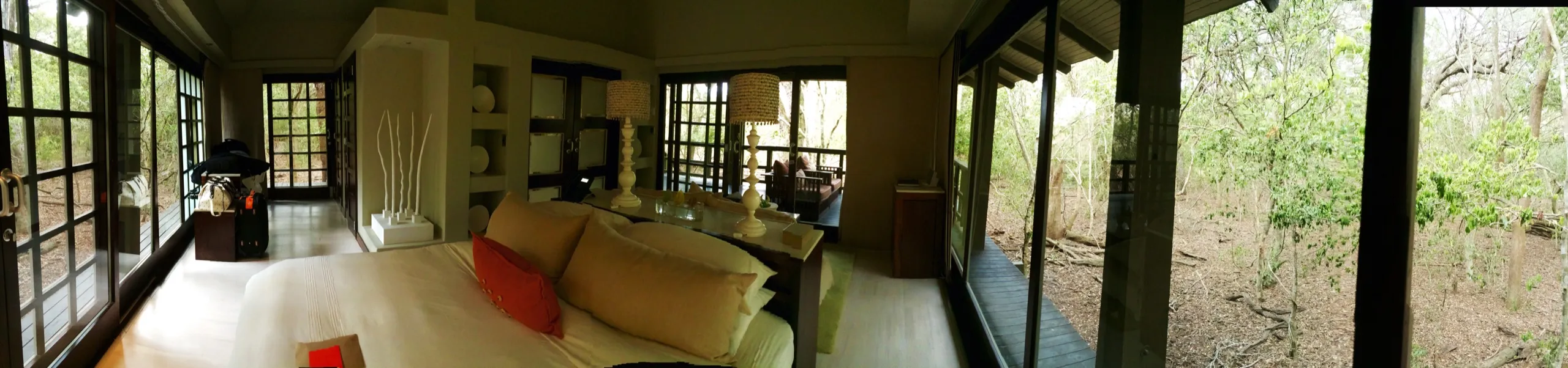 A wide view along the suite, glass on every side