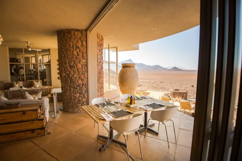 The lodge dining room, open along one side to the desert beyond