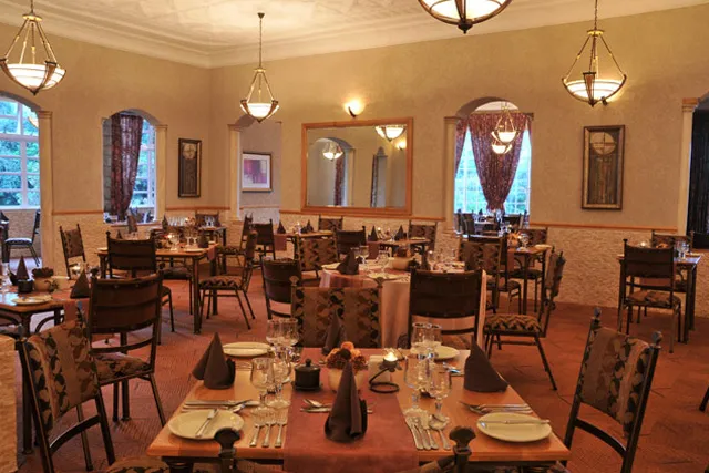 The hotel dining room laid up for dinner
