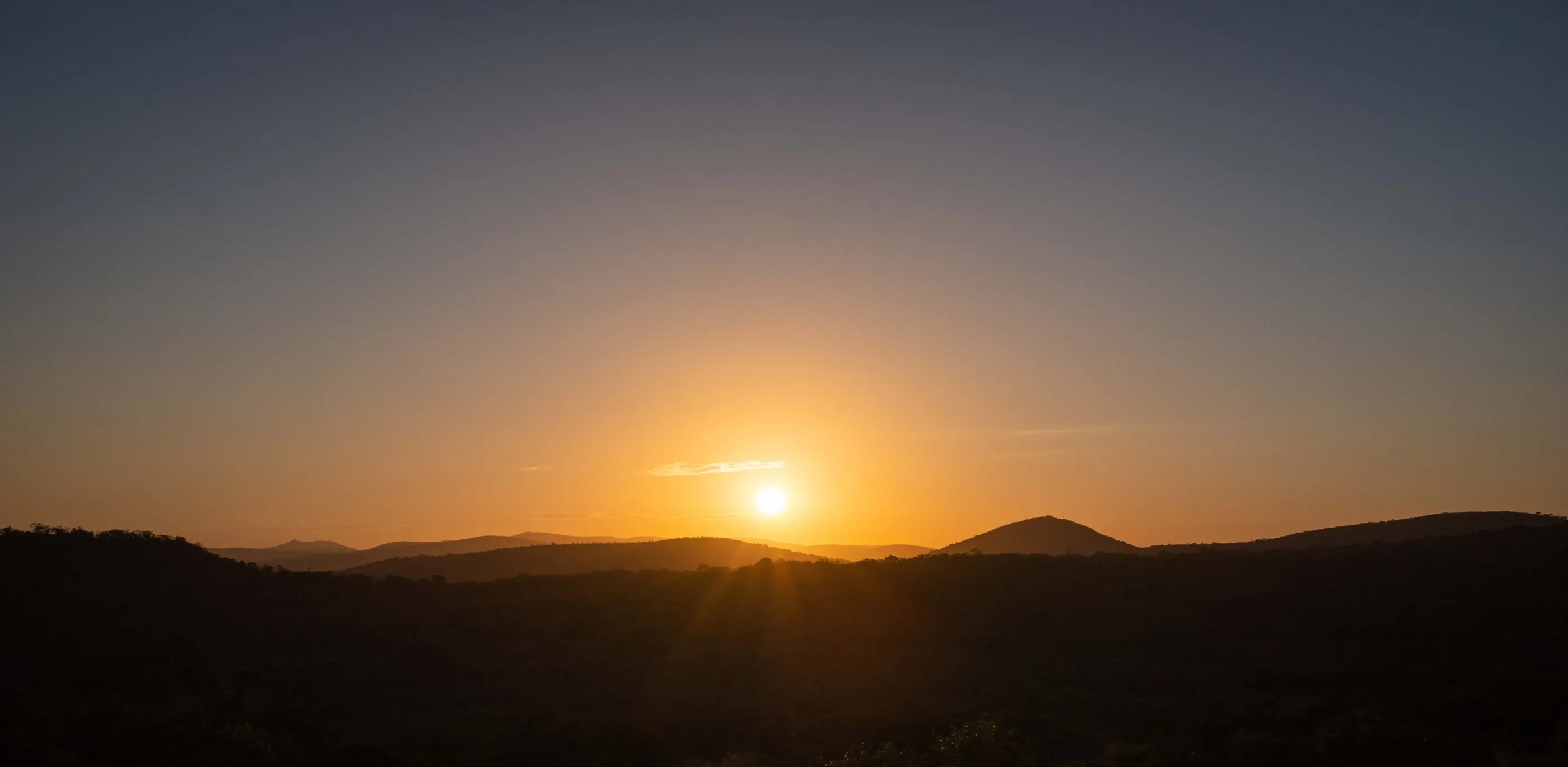 The sun setting over the rolling hills of Northern Zululand